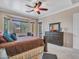 Relaxing primary bedroom featuring ample room, a bay window and dresser at 43510 N 44Th Ave, New River, AZ 85087