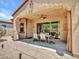 Inviting covered patio with a ceiling fan and a dining table, perfect for outdoor entertaining at 43510 N 44Th Ave, New River, AZ 85087