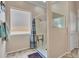 Modern walk-in shower featuring tile surround and built-in shelving at 43510 N 44Th Ave, New River, AZ 85087