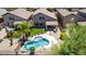 Backyard oasis with a sparkling pool, lush landscaping, covered patio, and ample space for outdoor entertaining at 4426 E Coyote Wash Dr, Cave Creek, AZ 85331