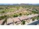 Aerial view of desert homes and a golf course, nestled amongst a mountain range at 4426 E Coyote Wash Dr, Cave Creek, AZ 85331