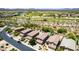 Scenic aerial view of desert homes near a golf course, pool, and mature desert landscape at 4426 E Coyote Wash Dr, Cave Creek, AZ 85331