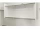 Spacious walk-in closet with built-in shelving and metal hanging rods, ready for organization at 4426 E Coyote Wash Dr, Cave Creek, AZ 85331