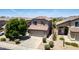 Inviting home with a well-kept lawn, mature trees, and a spacious driveway for ample parking at 4426 E Coyote Wash Dr, Cave Creek, AZ 85331