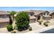 Well-maintained home with a spacious driveway, manicured landscaping, and a classic suburban design at 4426 E Coyote Wash Dr, Cave Creek, AZ 85331