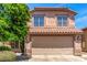 Exterior elevation of home featuring a tile roof and an attached two-car garage at 4426 E Coyote Wash Dr, Cave Creek, AZ 85331