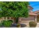 Beautiful exterior elevation view of a two-story home with a well-maintained lawn and desert landscaping at 4426 E Coyote Wash Dr, Cave Creek, AZ 85331