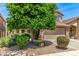 Charming two-story home featuring desert landscaping and a well-manicured front yard and an attached two car garage at 4426 E Coyote Wash Dr, Cave Creek, AZ 85331