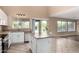 Kitchen features island, stainless appliances and view to backyard pool at 4426 E Coyote Wash Dr, Cave Creek, AZ 85331