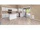 Modern white kitchen featuring a kitchen island and stainless steel appliances at 4426 E Coyote Wash Dr, Cave Creek, AZ 85331