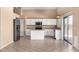 Bright, white kitchen with stainless steel appliances and a kitchen island at 4426 E Coyote Wash Dr, Cave Creek, AZ 85331
