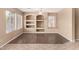 Neutral living space with built-in shelving units and large windows at 4426 E Coyote Wash Dr, Cave Creek, AZ 85331