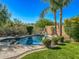 Backyard pool featuring rock accents, desert landscaping, and a fence at 4426 E Coyote Wash Dr, Cave Creek, AZ 85331