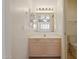 Bright bathroom features a single vanity, mirror and a view of a second room through the mirror at 4734 W Golden Ln, Glendale, AZ 85302