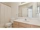 Bright bathroom featuring a single vanity and toilet with a shower and tub combo at 4734 W Golden Ln, Glendale, AZ 85302