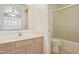 Bright bathroom features a single vanity and a step-in shower with glass doors at 4734 W Golden Ln, Glendale, AZ 85302