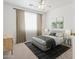 Bright bedroom with neutral tones, complemented by abstract art, a ceiling fan, and well-placed side tables and lamps at 4734 W Golden Ln, Glendale, AZ 85302