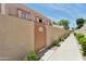 Exterior view of unit with private entrance, pathway, and tan stucco walls at 4734 W Golden Ln, Glendale, AZ 85302