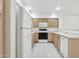 Bright kitchen with white appliances, wood cabinets, and a tiled floor at 4734 W Golden Ln, Glendale, AZ 85302