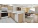 Well-designed kitchen with light wood cabinets, white countertops, and a functional layout open to the living space at 4734 W Golden Ln, Glendale, AZ 85302