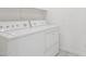 Bright laundry room with a side-by-side washer and dryer, plus neutral paint and tile flooring at 4734 W Golden Ln, Glendale, AZ 85302