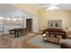 Open-concept living and dining area with a seamless flow, hardwood floors, and modern furnishings at 4734 W Golden Ln, Glendale, AZ 85302