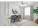 Bright home office with a modern desk, stylish chair, and large windows for natural light at 4734 W Golden Ln, Glendale, AZ 85302