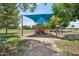 Community playground with shade cover and equipment for climbing, sliding, and more at 4734 W Golden Ln, Glendale, AZ 85302