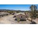 Aerial view of the single-Gathering home and auxiliary structure in a desert landscape at 48451 N 27Th Ave, New River, AZ 85087