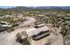 Aerial view showcases the sprawling property, including the house and surrounding landscape at 48451 N 27Th Ave, New River, AZ 85087