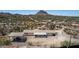 Aerial view of property featuring a car port, desert landscape and mountain views at 48451 N 27Th Ave, New River, AZ 85087