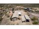 An aerial view of a charming house with a large, desert landscape and a convenient two car carport at 48451 N 27Th Ave, New River, AZ 85087