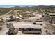 Aerial view showcases the sprawling property, including the house and surrounding landscape at 48451 N 27Th Ave, New River, AZ 85087