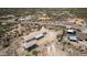 An aerial view of a charming home with a large, desert landscape and a convenient two car carport at 48451 N 27Th Ave, New River, AZ 85087