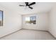 Bright bedroom features carpeted floors, light neutral walls, and plenty of natural light at 48451 N 27Th Ave, New River, AZ 85087