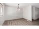 An empty dining room with grey-brown trim, and new flooring ready for your special design at 48451 N 27Th Ave, New River, AZ 85087