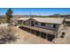 A beautiful single-story home featuring a large deck and mountain views at 48451 N 27Th Ave, New River, AZ 85087