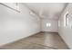Garage with concrete floor, mini-split unit, windows, and lights at 48451 N 27Th Ave, New River, AZ 85087