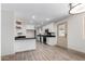 Modern kitchen featuring white cabinets, granite countertops and stainless appliances at 48451 N 27Th Ave, New River, AZ 85087
