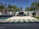 Amazing backyard with a fireplace, lounge area, and lush landscaping perfect for outdoor living at 5088 S Ponderosa Dr, Gilbert, AZ 85298