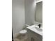Stylish powder room with a modern vanity, gold fixtures, and ample lighting at 5088 S Ponderosa Dr, Gilbert, AZ 85298