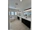 Modern bathroom featuring a luxurious soaking tub, double vanities, and contemporary fixtures at 5088 S Ponderosa Dr, Gilbert, AZ 85298
