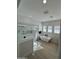 Bright bathroom featuring a glass-enclosed shower and soaking tub, complemented by natural light from shuttered windows at 5088 S Ponderosa Dr, Gilbert, AZ 85298