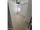 Open bedroom showcasing neutral tones, a modern ceiling fan, and natural light at 5088 S Ponderosa Dr, Gilbert, AZ 85298