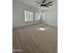 Bright bedroom features modern ceiling fan, plantation shutters and beautiful hardwood flooring at 5088 S Ponderosa Dr, Gilbert, AZ 85298