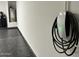 Garage view featuring a Tesla charging station, water heater, and epoxy flooring for modern convenience at 5088 S Ponderosa Dr, Gilbert, AZ 85298
