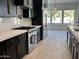 Modern kitchen with stainless steel range and appliances, with bright windows and an open space at 5088 S Ponderosa Dr, Gilbert, AZ 85298