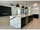 Spacious kitchen with a waterfall island, modern lighting, and stylish finishes at 5088 S Ponderosa Dr, Gilbert, AZ 85298