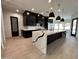 Stylish kitchen featuring a large island with white countertop and black cabinets at 5088 S Ponderosa Dr, Gilbert, AZ 85298