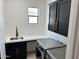 Modern laundry room with stainless steel appliances, contemporary cabinetry, and a functional layout at 5088 S Ponderosa Dr, Gilbert, AZ 85298